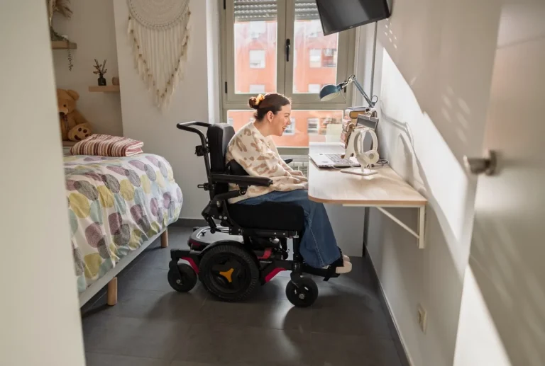 Disabled woman at home at desk