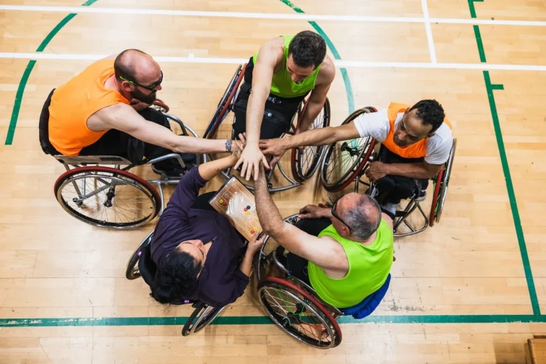 Group of disabled friends playing basketball